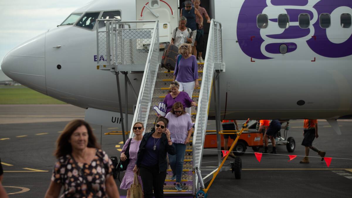 Customers disembark Bonza airlines' inaugural flight from the Sunshine Coast into Newcastle Airport in March. Picture by Jonathan Carroll.