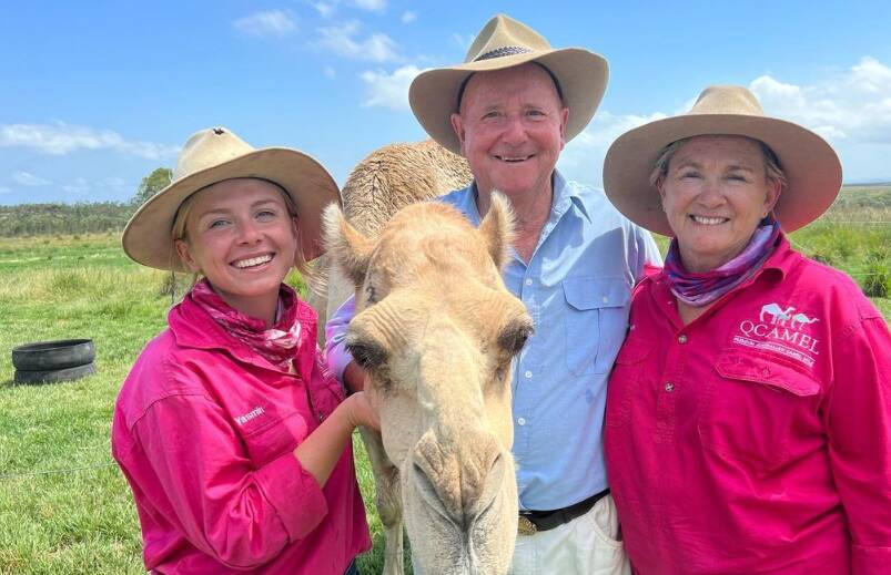 Yasmin Brisbane (left) with Dr Harry Cooper (centre) on Q Camel farm in Beerwah. Picture via Yasmin Brisbane