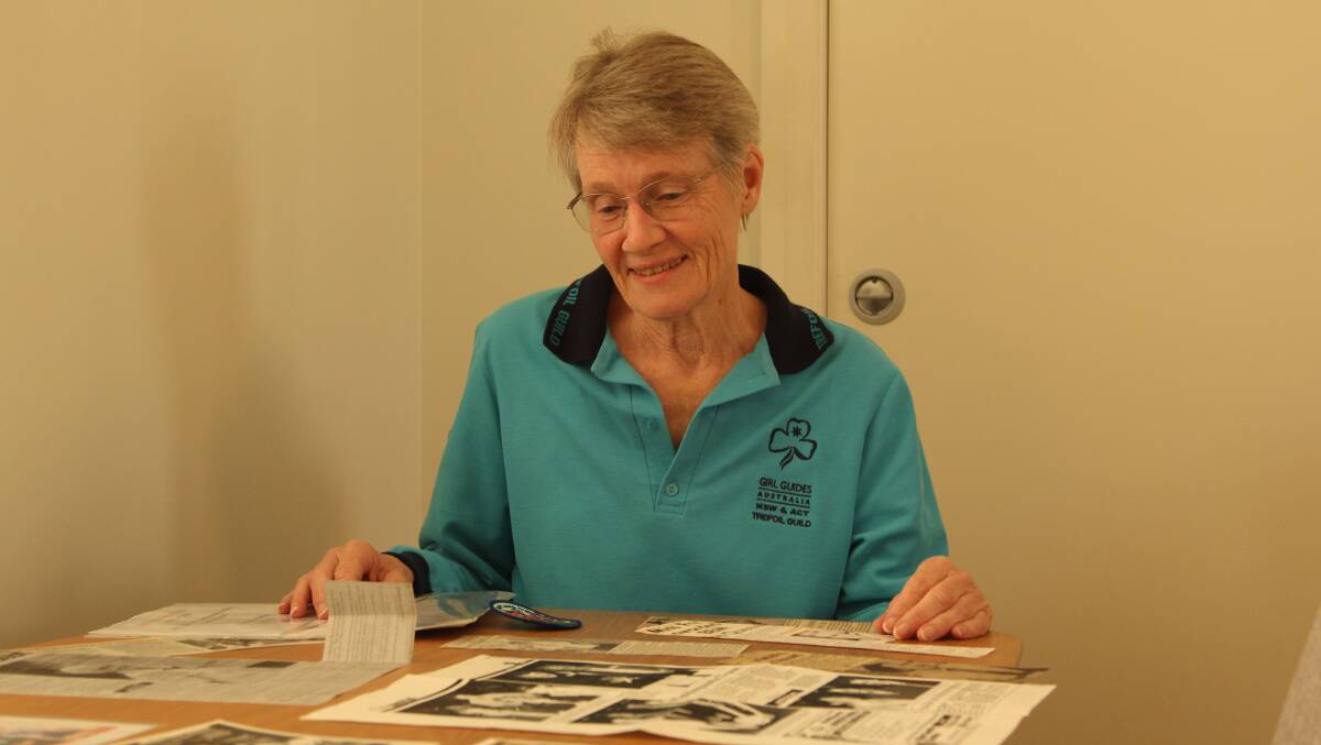 Historian and former Guide leader Sue Folpp looks over some of the collection which will be displayed as part of the 100 year centenary of girl guiding in Maitland. The launch of the celebration will happen on Saturday, May 6 at Maitland Guide Hall. Picture by Ben Carr
