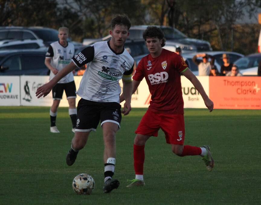 Magpies co-skipper James Thompson (left) passes the ball against Broadmeadow in round six of the NNSW NPL. The attacker scored a goal in Maitland's win over Lambton Jaffas on Wednesday, April 26. Picture by Ben Carr