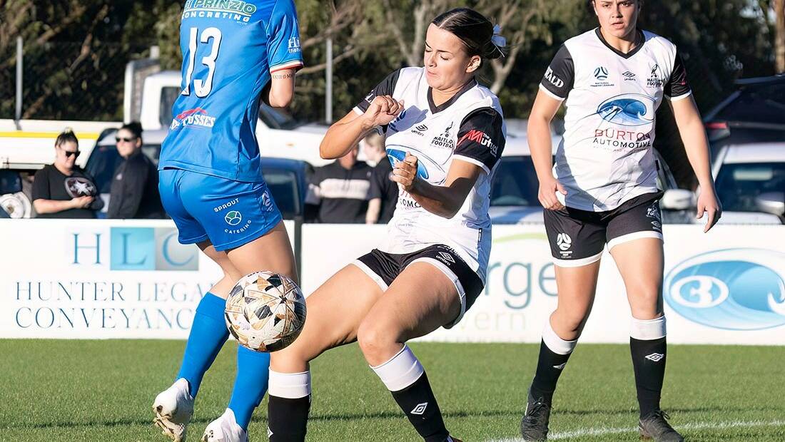Maitland's Amy Parkinson contests for the ball against Charlestown Azzuri in round eight of the NNSW NPLW on Sunday, April 30 at Cooks Square Park. Picture by Graham Sport and Nature Photography