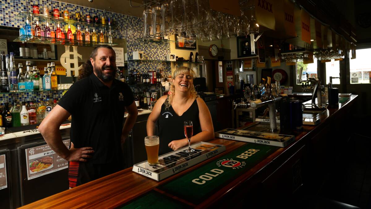FUN: Josh Hogg and Laura Johnson have a laugh behind the bar at the Chelmsford Hotel, home of Mulletfest. Picture: Jonathan Carroll