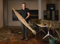 Mitch Mahoney showing how a river reed canoe is made in 2023 at Maitland Regional Art Gallery. Picture by Marina Neil