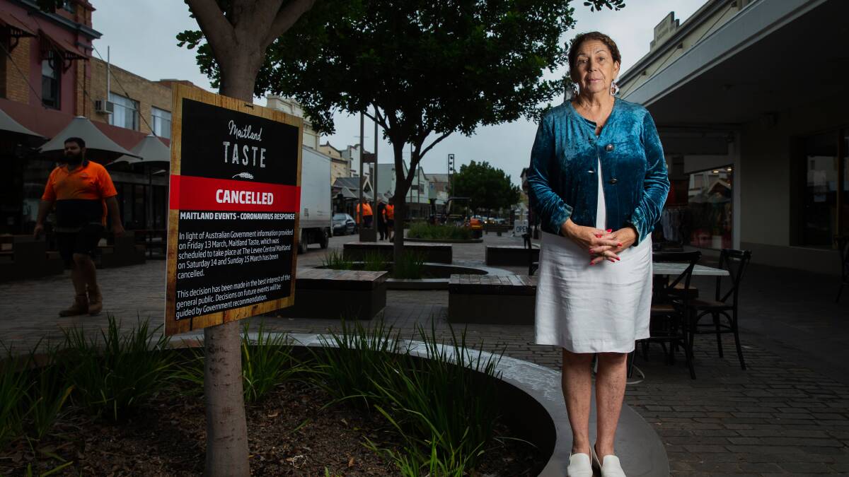 AXED: Maitland mayor Loretta Baker with the cancellation sign for this year's Taste Festival. Picture: Marina Neil