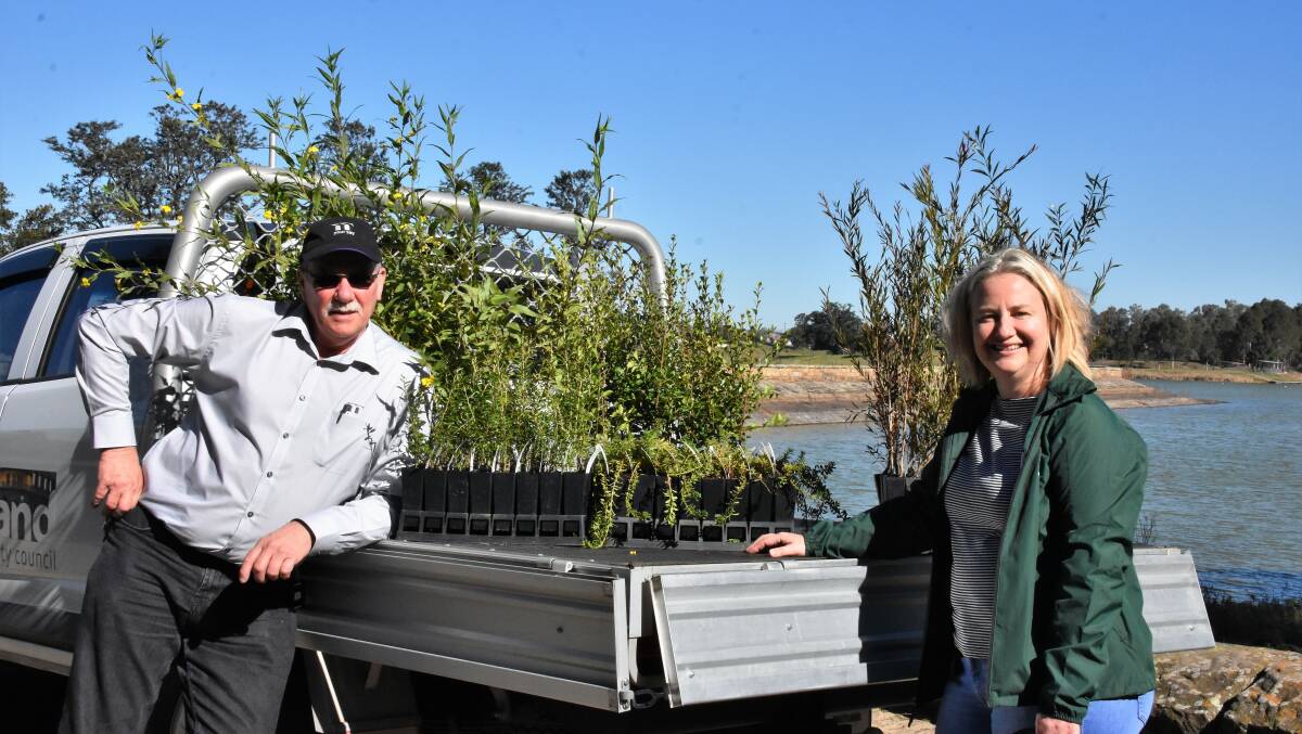BLOOMING: Maitland Council's environmental programs officer Michael Tinlin and environmental strategy and programs coordinator Deanne Nelson-Pritchard at Walka Water Works.