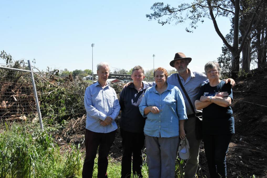 ANGRY: Chris Richards, Marg Edwards, Jan Davis, Bob Dennerley and Wendy White at the High Street site where the vegetation had been removed.