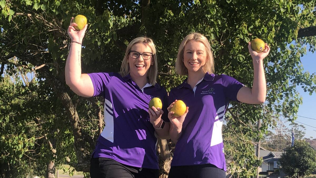 FUNDS: Friends of Palliative Care Maitland publicity officer Rhiannon Varley and Vice chairperson Montana Duggan are selling mangoes to raise funds.