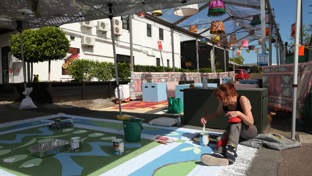 ART ATTACK: Patricia Van Luveck of Studio Amsterdam is working on a mural in the main street as part of Morph It. Picture: Simone De Peak