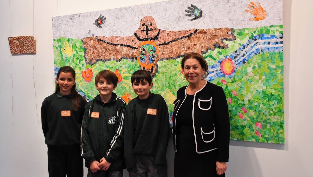 EXPRESSION: Telarah Public School pupils and mayor Loretta Baker with their artwork at Maitland Regional Art Gallery.