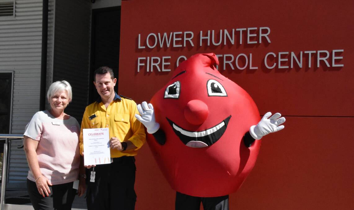 DONATE: Donor Cente manager Michelle Short, RFS operational officer Guy Baddock and Billy the Blood Drop at the Lower Hunter Centre.