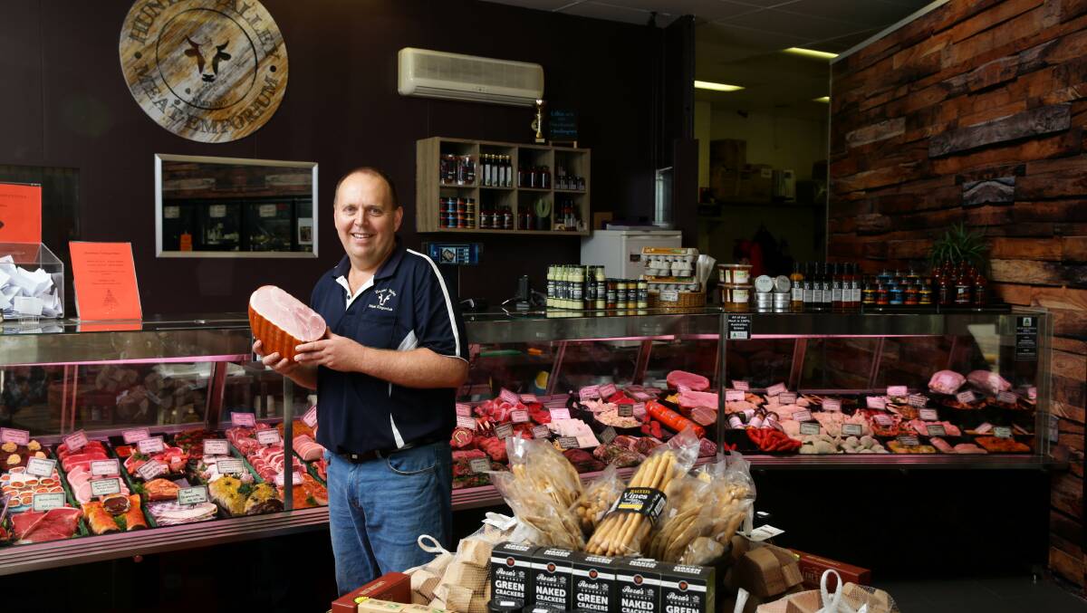 WINNERS: Hunter Valley Meat Emporium owner Steffan Harris with the butchery's award winning boneless leg ham. Picture: Jonathan Carroll