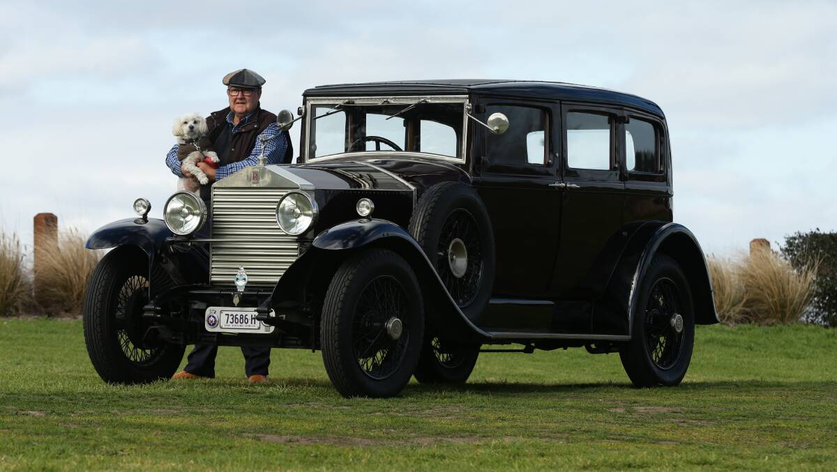 READY TO ROLL: Bob Roberts, pictured with his dog Hector, is auctioning off rides in his vintage Rolls Royce to raise funds for the regional museum. Picture: Jonathan Carroll