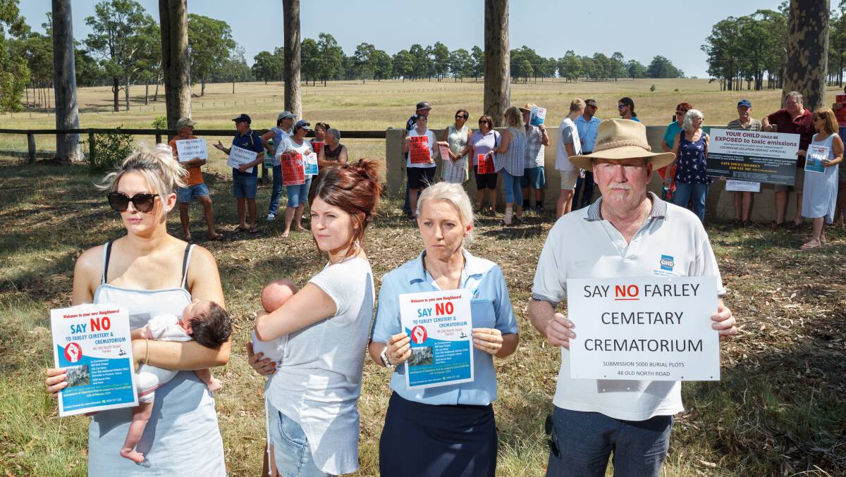 PUSH: Tash McKenzie, baby Taya, Dana Bright with daughter Everly, Amanda Morris, and Geoff Bright are outraged by a proposed crematorium in Farley. Picture: Max Mason-Hubers