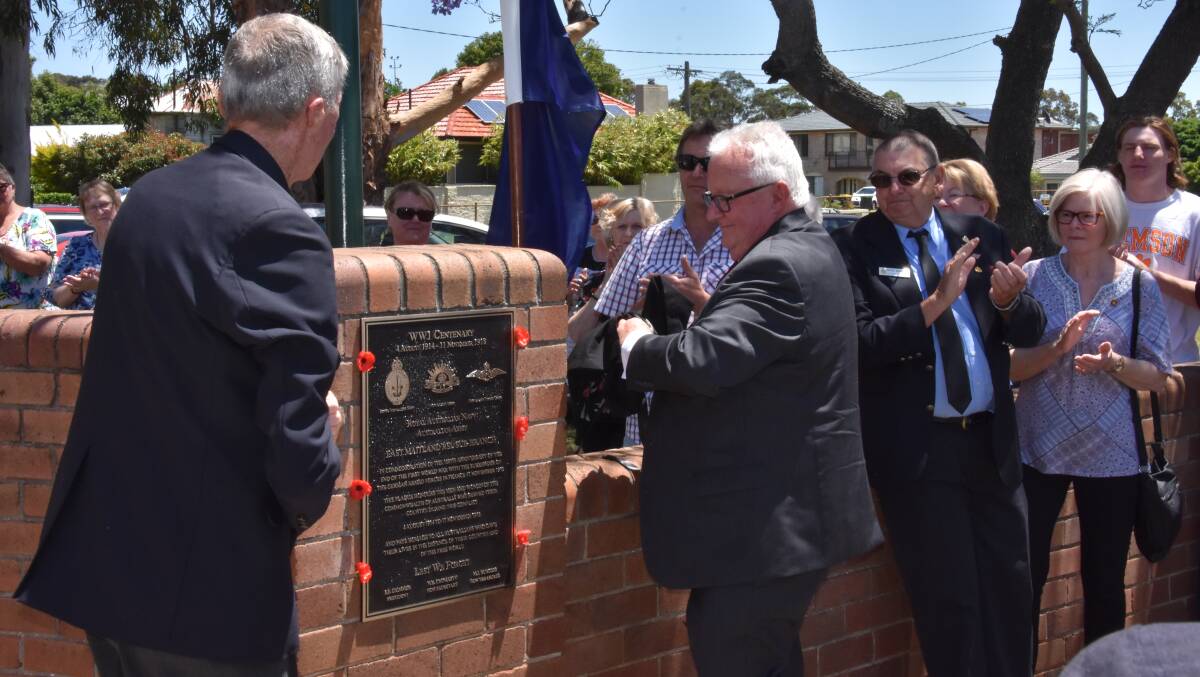 PAY TRIBUTE: East Maitland RSL sub-branch members Brian Boughton and Peter Hedges unveiled one of two new plaques on Remembrance Day. 