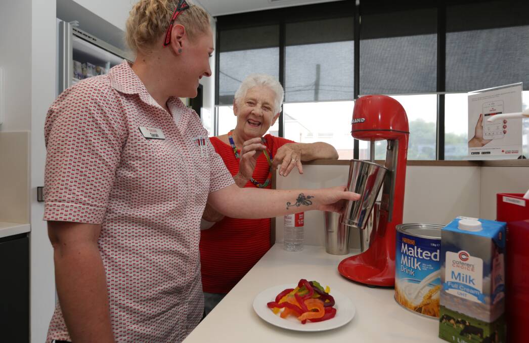 DONATE: Long time donor Helen Shearer, right, with nurse Sarah Sherman in the kitchenette area of the Maitland Donor Centre, where donors are treated after a donation. Picture: Simone De Peak