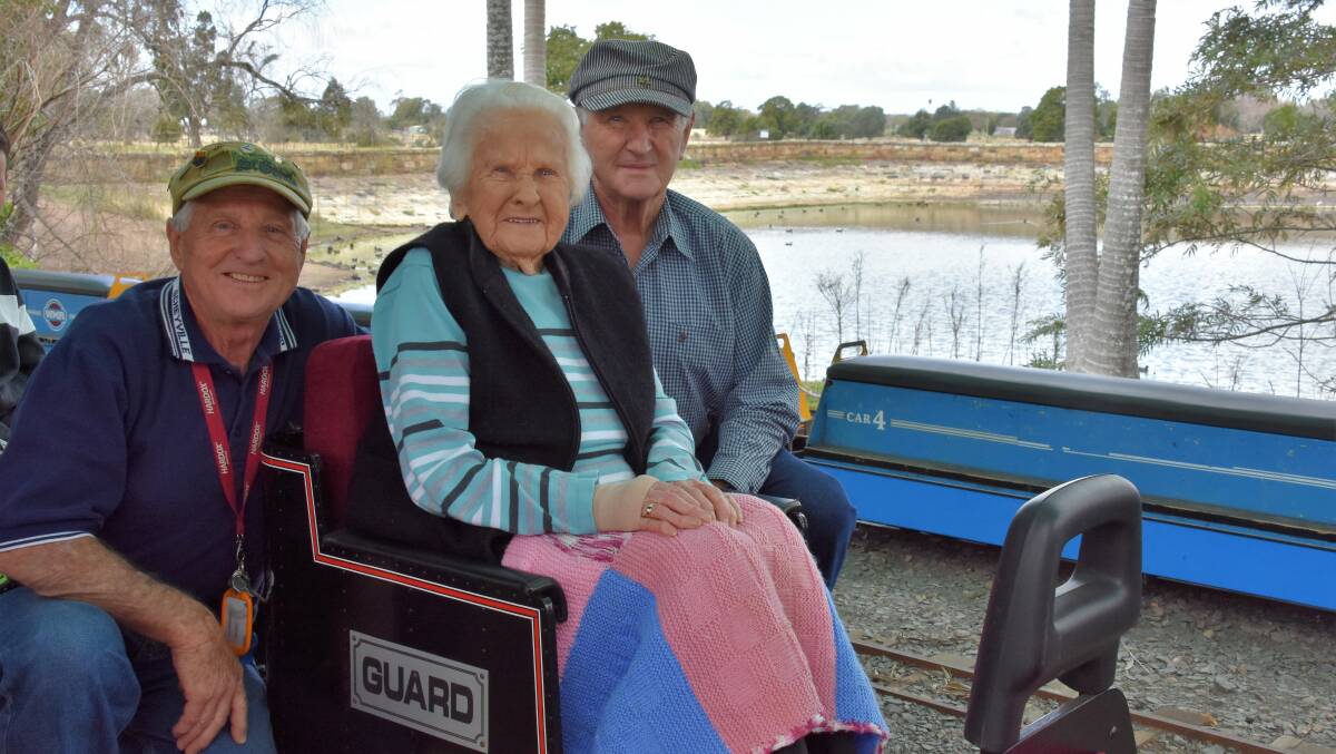 PARTY: Bea Brien with her sons Ian and John at her 103rd birthday celebration on Sunday. She rode the Walka Miniature Railway as part of the festivities.
