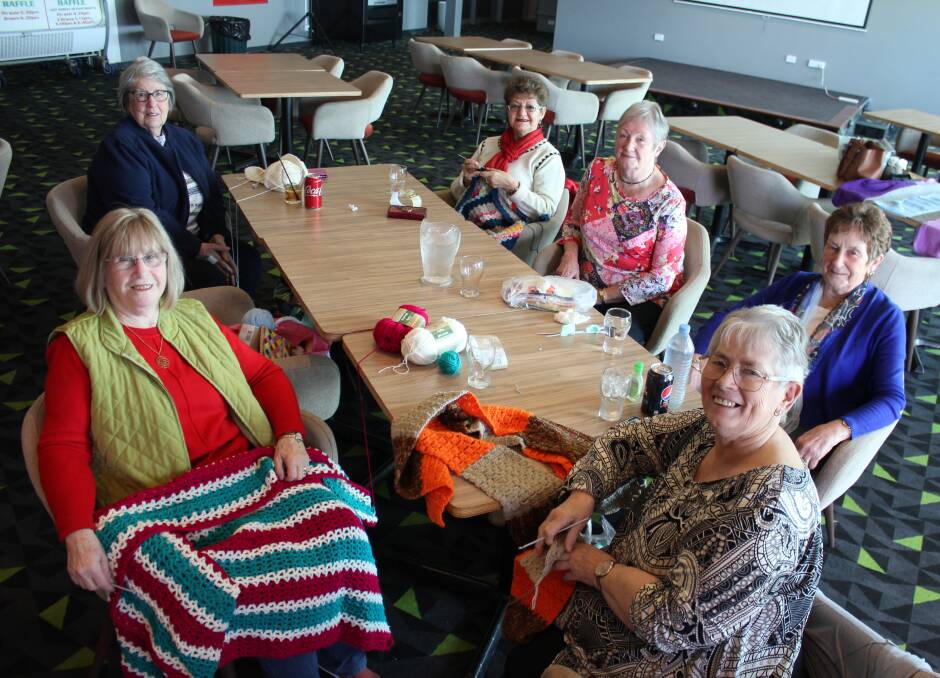 Hooked on giving: (Clockwise from left) Maree Solomons, Elaine Kennett, Helen Nicholls, Margaret Button, Sandra Cartwright and Jan Shand love to crochet and knit togethjer for a good cause.