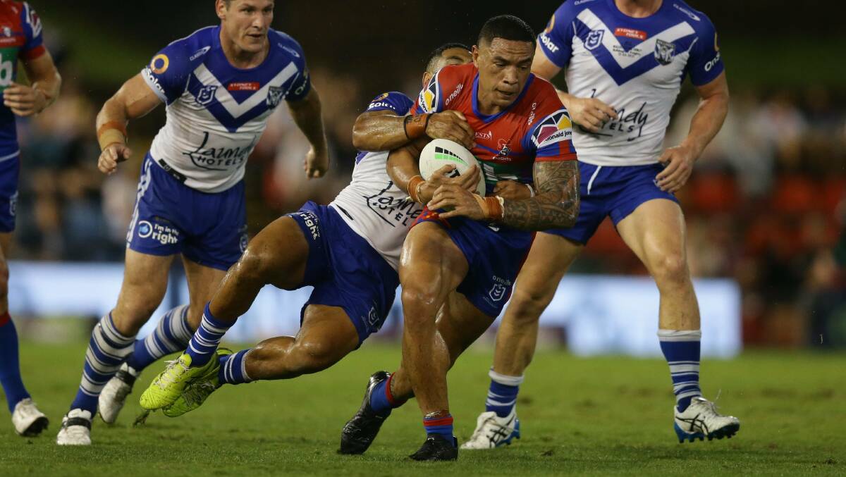 NEW COLOURS: Newcastle Knight Tyson Frizell makes one of 14 hit ups against the Bulldogs in last weekend's game. Picture: Jonathan Carroll