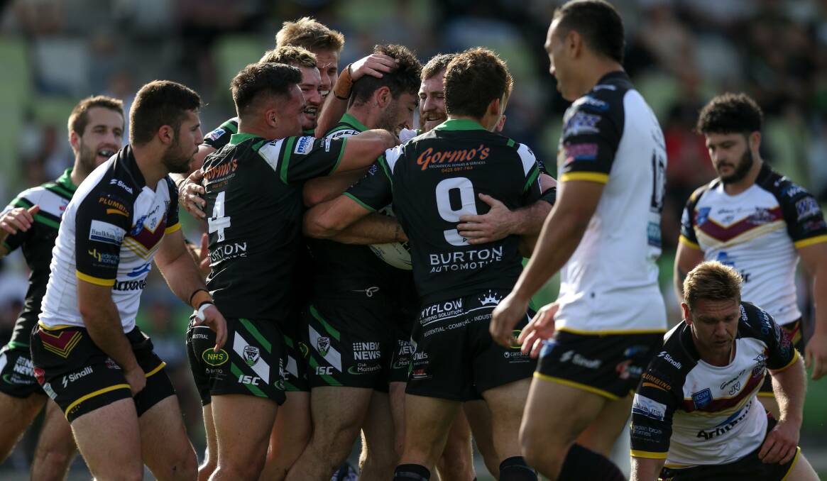 PLENTY OF POINTS: Maitland players congratulate Brock Lamb after he scores the opening try against Hills Bulls on Saturday. Picture: Marina Neill