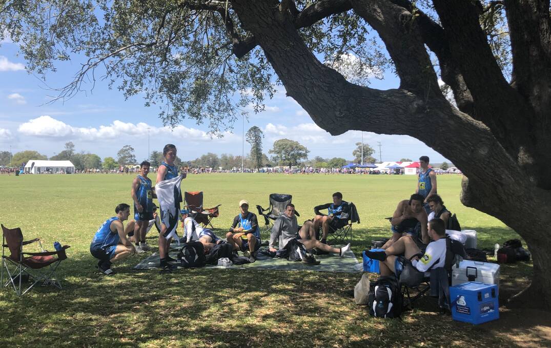 FIELDS OF DREAMS: The Peninsula team from the Central Coast take a break during the Regional Touch Football Championships on the weekend.