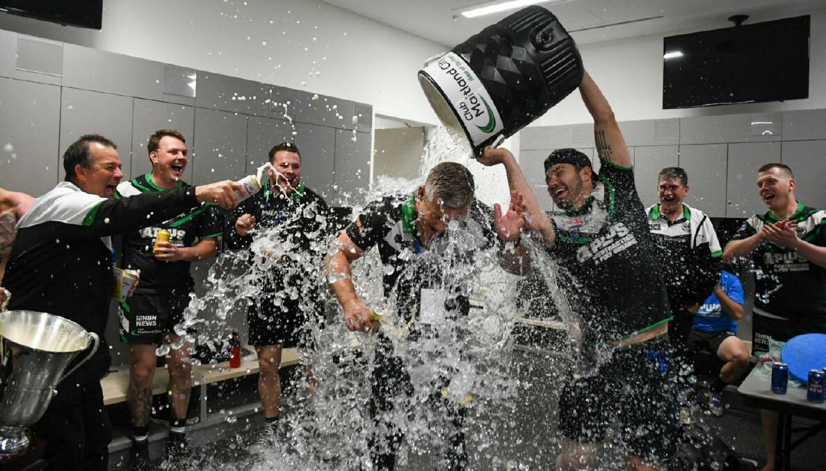 Winners are grinners and premiership coaches get drenched. Picture: Smart Artist