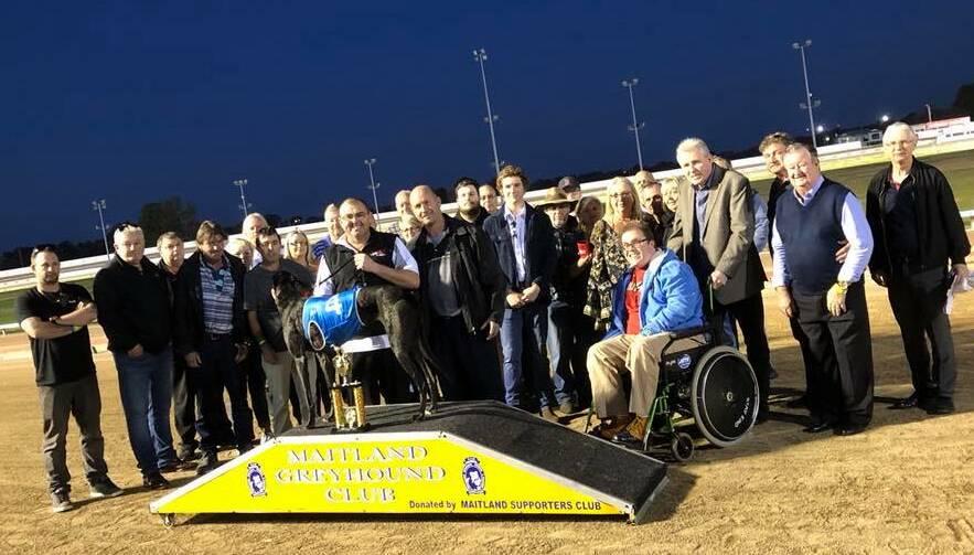 SUCCESS: Richmond Vale trainer Jason Mackay and handler Daniel Flanagan with Zipping Buddy after winning the Ron Reid Life Trophy Final at Maitland last Thursday.
