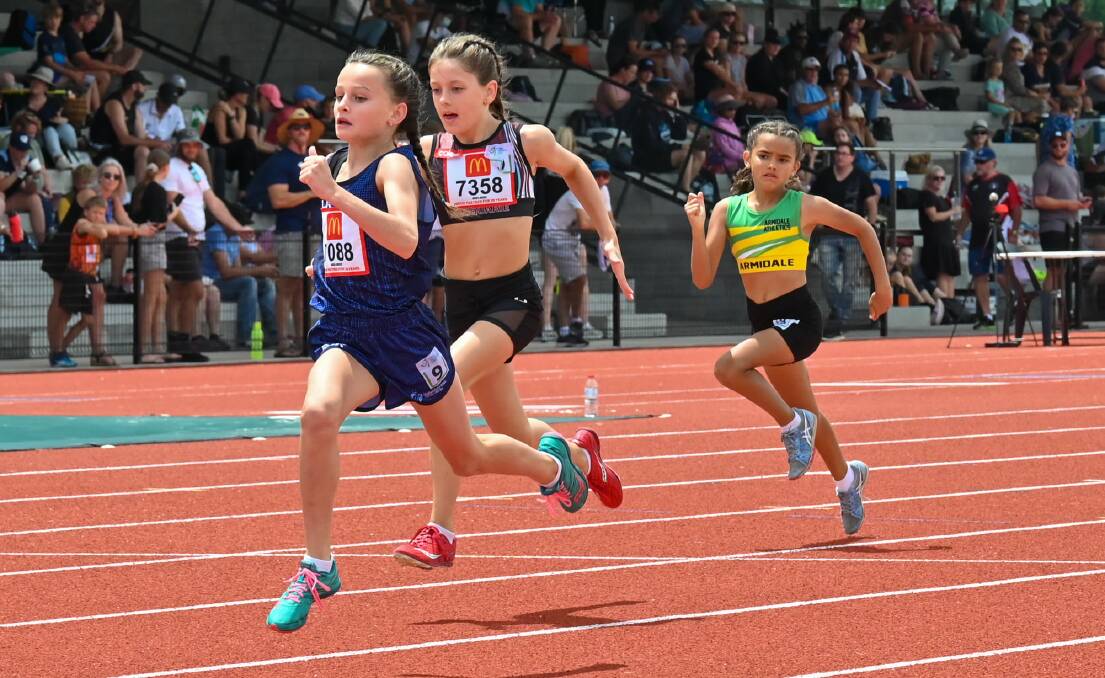 Audrey Jaunalksnis, 8, sprints home to win gold in the under-9 100 metres. Picture: Athletics NSW