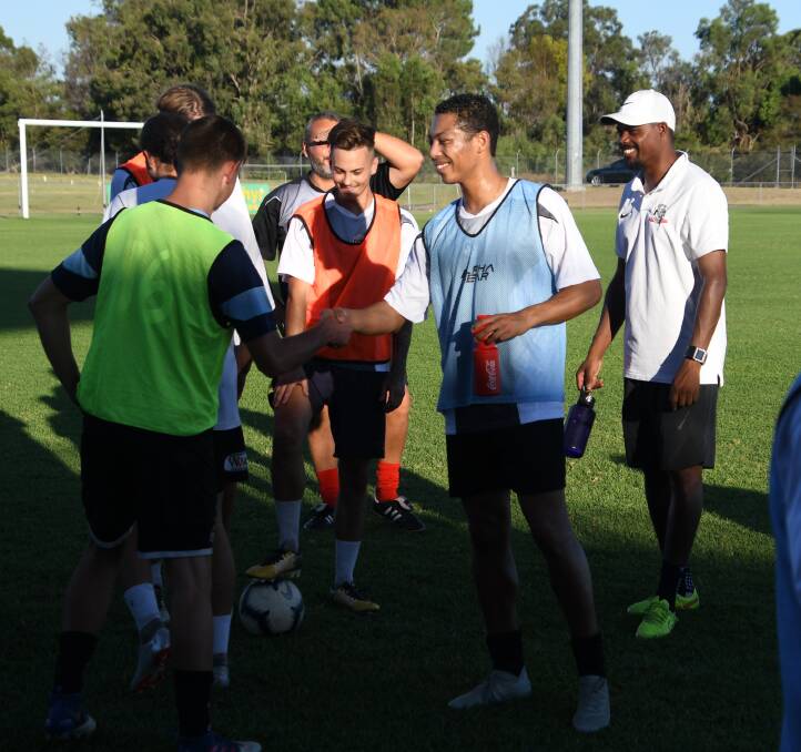 WELCOME ABOARD: Dutch import Jason Thien-Fooh (centre) is introduced to his new Bears teammates at training on Monday night. Picture: Michael Hartshorn