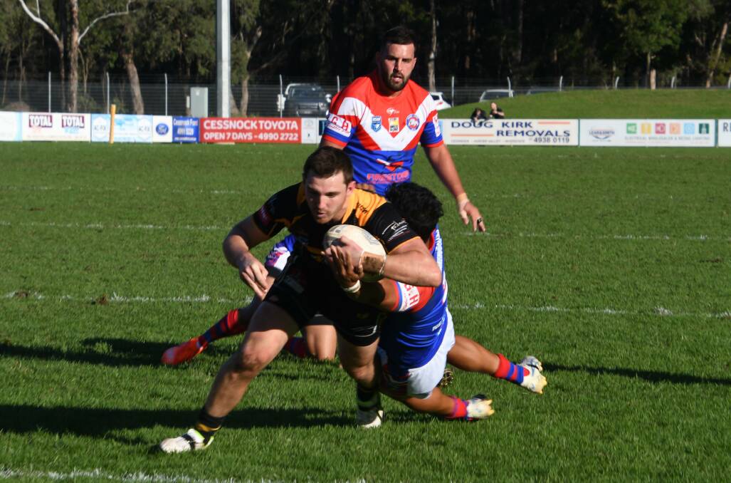 Cessnock back-rower Reed Hugo busts through the defence to dive in for a try.