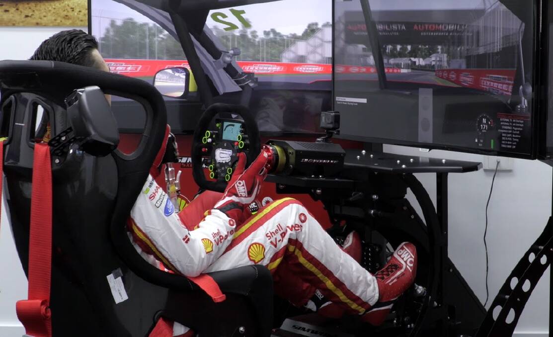  Fabian Coulthard using his team's eRacing simulator for training.