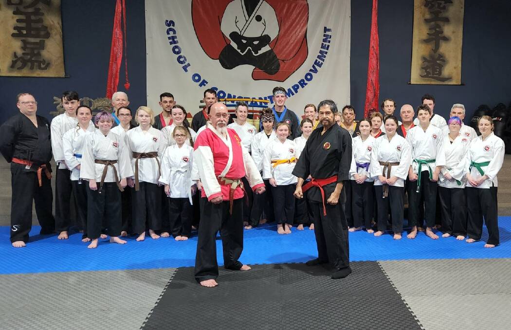 Kyoshi Peter Kirkwood receives his 7th Dan grading from the father of Australian karate Hanshi Tino Ceberano at Kirkwood's Institute of Karate.