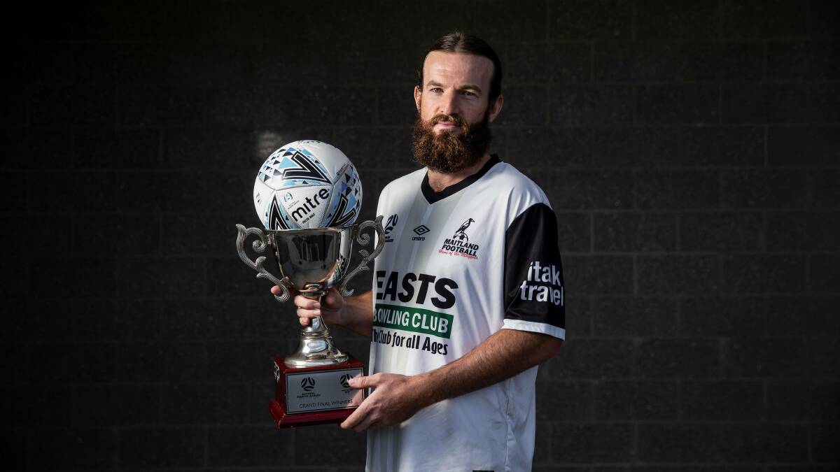 CUP DREAM: Maitland skipper Carl Thornton holds the Champions Cup for the winner of the NPL grand final ahead of Sunday's decider. Picture: Marina Neill