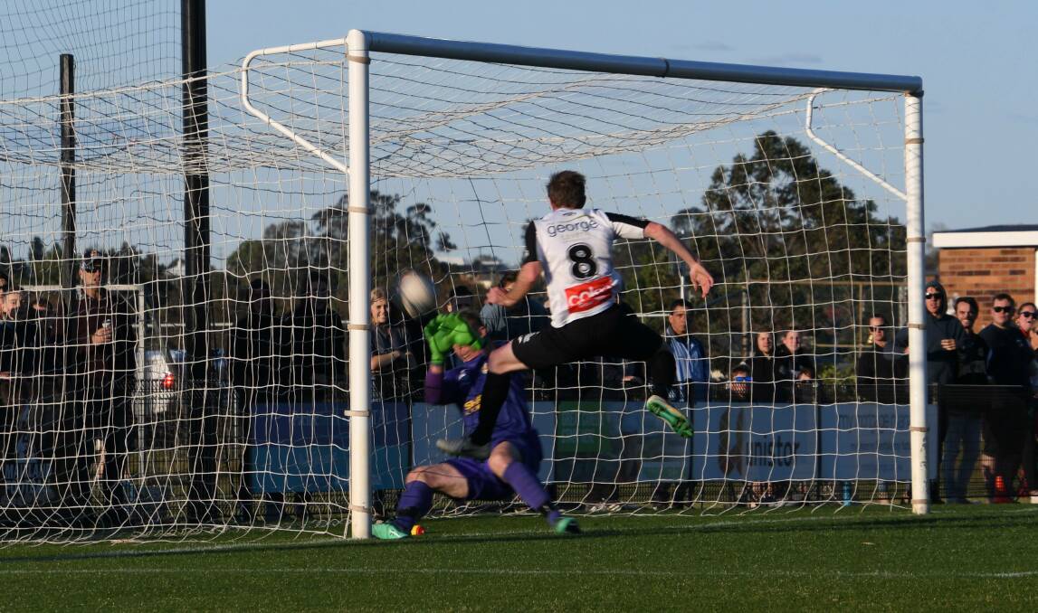 GRAND GOAL: Maitland's Matty Thompson scores the equaliser in the 92nd minute to send the Magpies into the NPL grand final. Picture: Michael Hartshorn