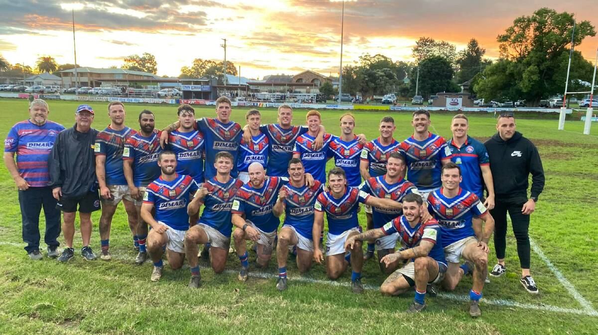 Reward: The Bulldogs players and staff celebrate in front of the Old Boys Shed after winning their first home game of the season. Picture: Supplied.