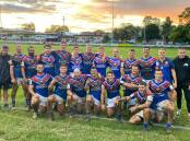Reward: The Bulldogs players and staff celebrate in front of the Old Boys Shed after winning their first home game of the season. Picture: Supplied.