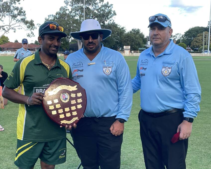 Western Suburbs all-rounder Jeewan De Silva receives the man of the match trophy from the umpires. Picture by Michael Hartshorn.