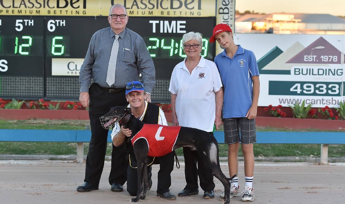 TRACK RECORD: Old Spice's connections are joined by Maitland Greyhound Club promotions manager Fred Robertson (left)  after breaking the 450m track record at Maitland.