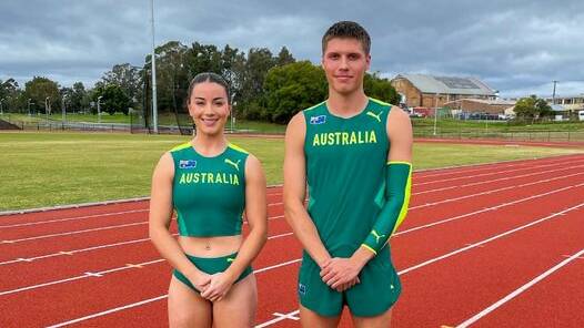 Brittany Carroll and Mitch Lightfoot wearing their Australian uniforms at their home base the Maitland Regional Athletics Centre. Picture: Maitland City Council.