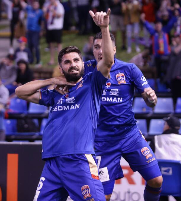 MAITLAND-BOUND: Newcastle Jets player Nick Cowburn, pictured celebrating a goal against Sydney in November, has signed with the Maitland Magpies.