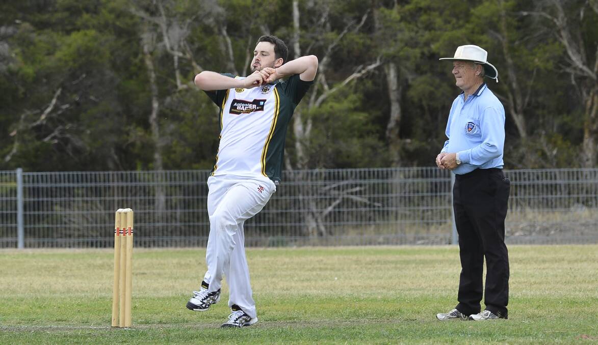 LOVE OF CRICKET: Rick Carr behind the stumps in his familiar role as one of Cessnock and the Hunter's most respected umpries.