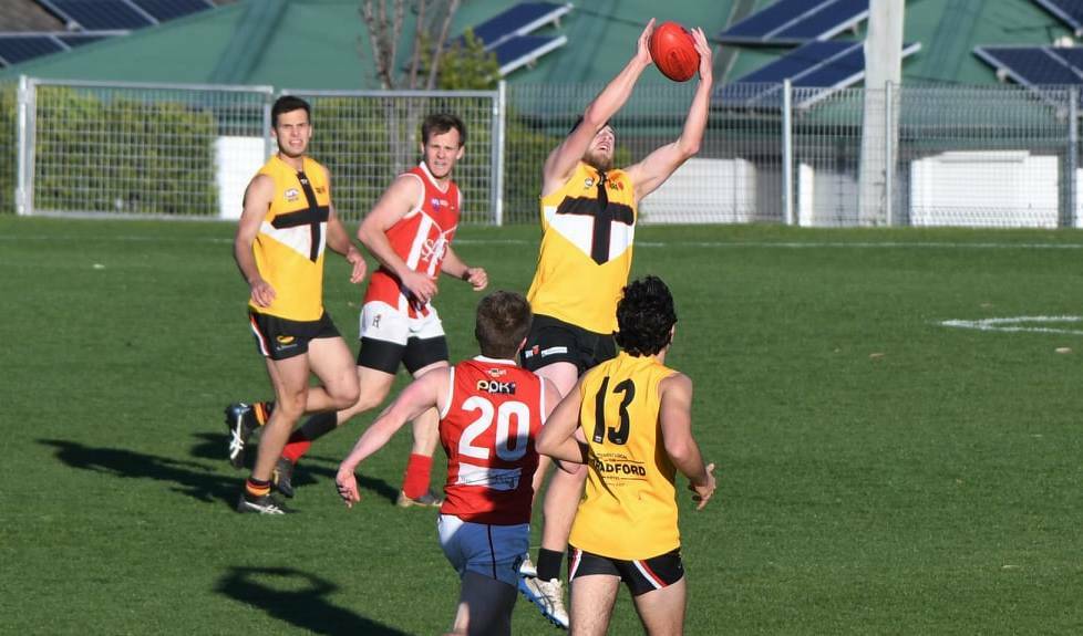 Maitland Saints forward Hugh Matheson takes a strong mark before going back to kick a goal. Picture: Grant Power