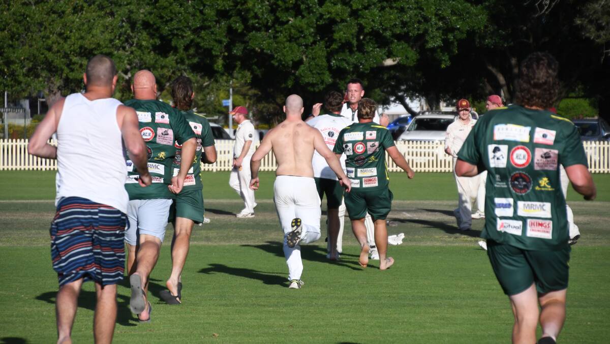 Western Suburbs players race out to celebrate with Harry King after he blocked out the final ball for a memorable semi-final win against City United at Robins Oval on Sunday, March 10, 2024. Picture by Michael Hartshorn