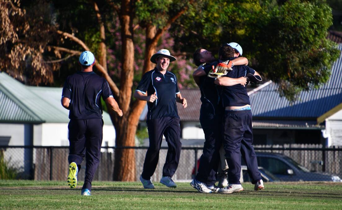 Kurri Weston players celebrate victory against City United during last year's Old Boys Day.