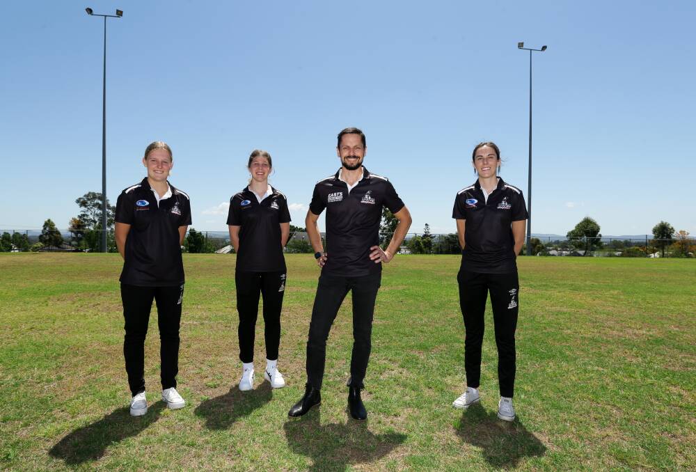 EXCTING TIMES: New Maitland Magpie's women's coach David Walker with players (from left) Bronte Peel, Mercedes McNabb and Madi Gallegos at Cooks Square Park. Picture: Jonathan Carroll