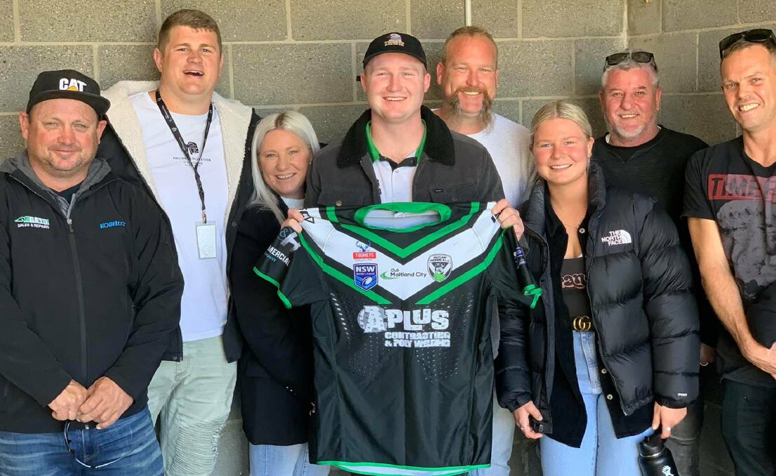 PROUD MOMENT: Taj Ridley with family after the presentation of his jersey to mark his first grade debut.