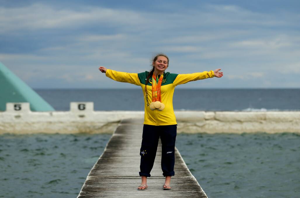 TWO ICONS: Maitland's Maddi Elliott had a media call at the Newcastle Ocean Baths on her return to the Hunter on Thursday. Picture: Jonathan Carroll