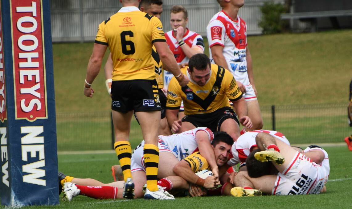 Nick Lawrence crosses for the final try in Cessnock's 20-6 grand final win against South Newcastle. Picture: Michael Hartshorn