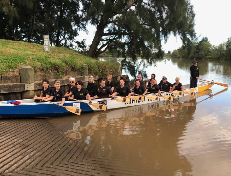 PADDLING ON: Hunter River Dragons try out the club's new paddles purchased with a Maitland City Council grant.