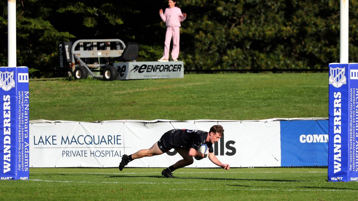 DOUBLE: Maitland Blacks fullback Pat Batey dives in to score one of his two tries. Picture: Peter Lorimer.