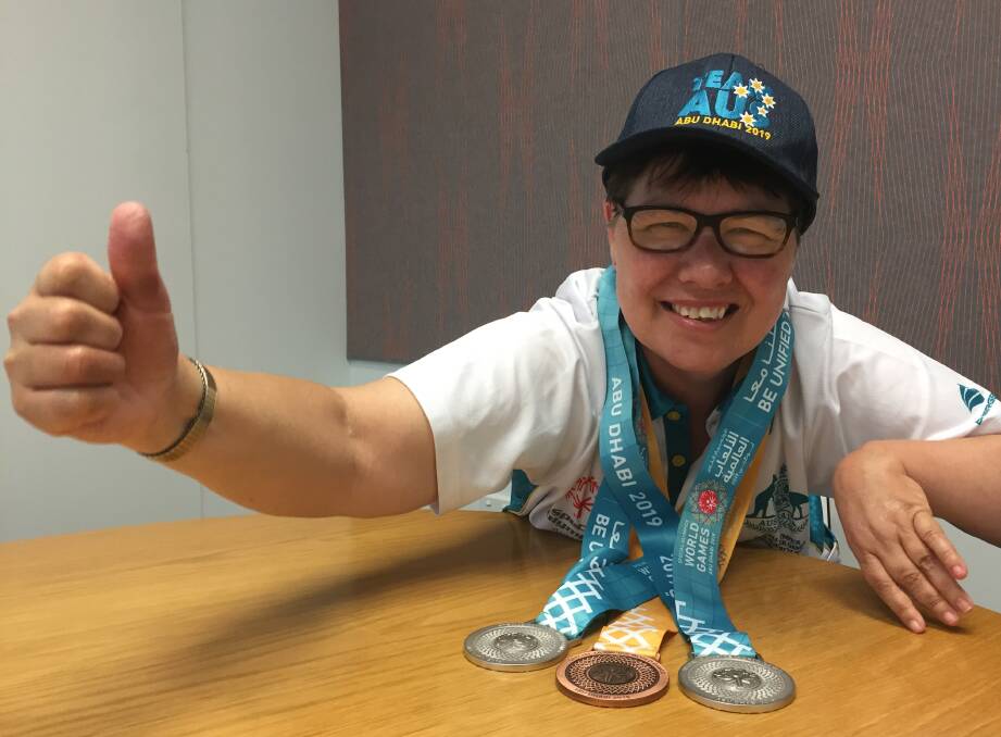 THUMBS UP: Despite missing out on gold by just one pin, Mary Marks is thrilled with two silver and a bronze medal from the World Special Olympics in Abu Dhabi.